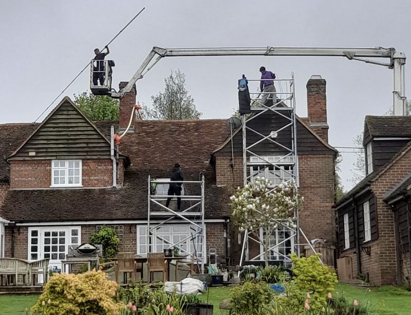 The Roof Moss Cleaners using cherry picker and scaffolding to clean roof safely and professionally in Kingswood, Gloucestershire